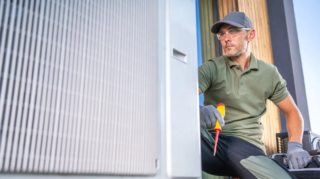HVAC technician inspecting heating system during pre-listing preparation