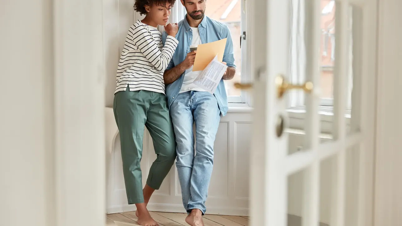 Confident buyers touring well-maintained home during pre-closing inspection