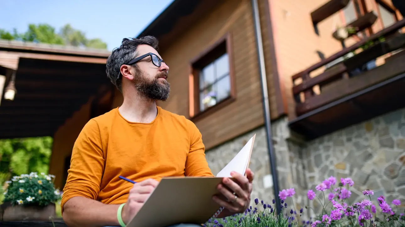 Agent, buyer, and seller standing together near an open doorway, daylight spilling through—unity in the quiet success of readiness. Fix before closing.