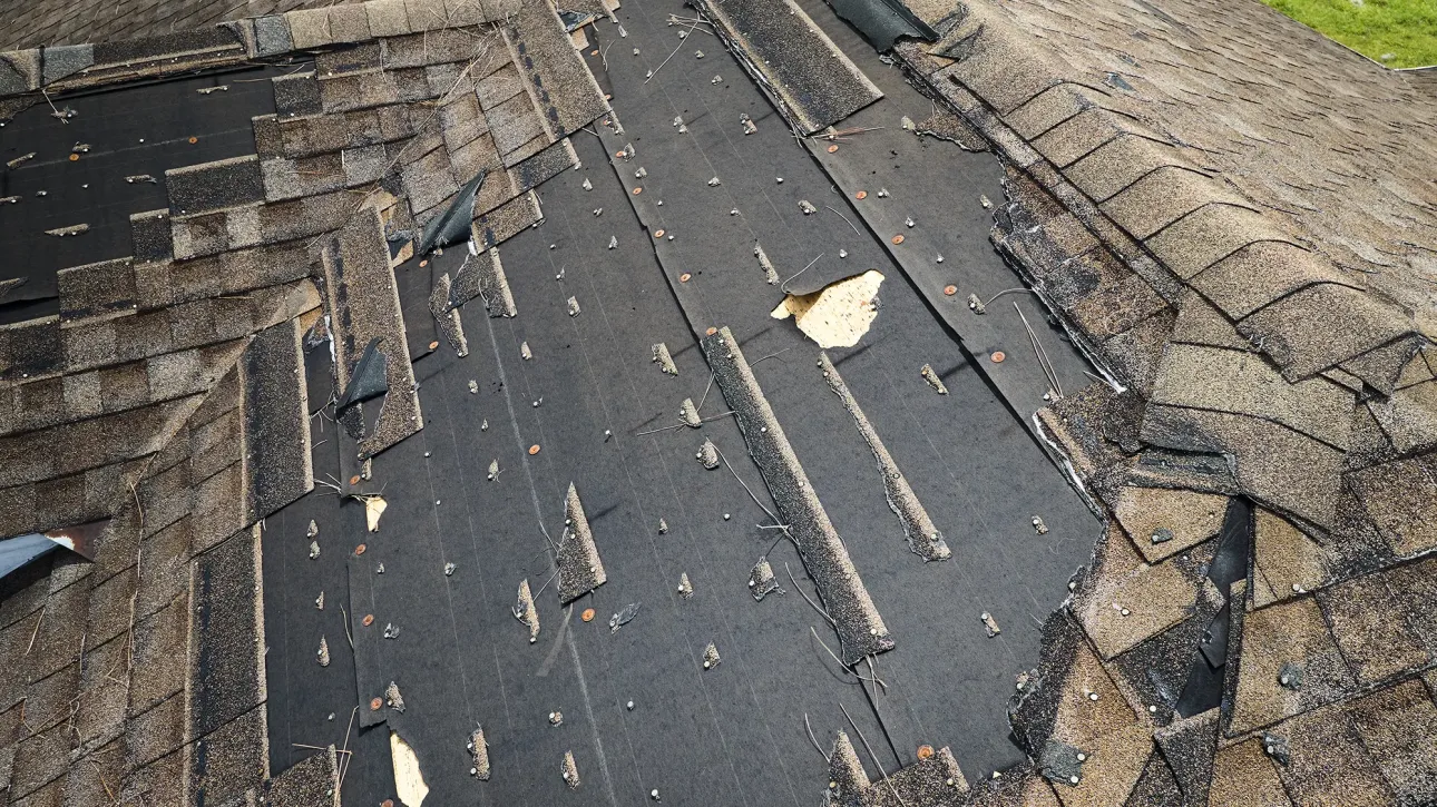 Hail damage impact marks on Texas home roof shingles documented during inspection repair assessment